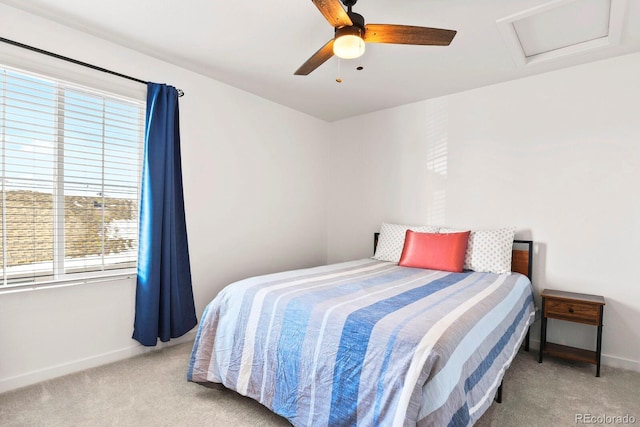 bedroom featuring light colored carpet and ceiling fan