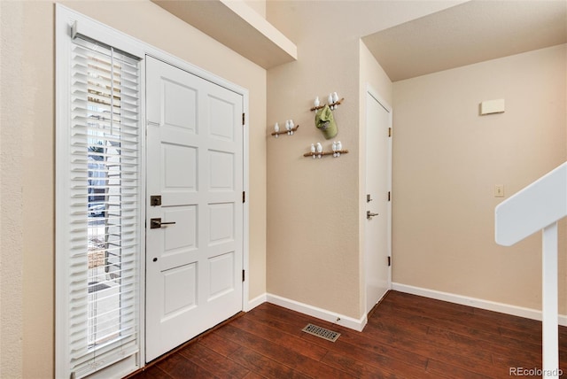 entrance foyer featuring dark wood-type flooring