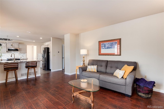 living room with dark hardwood / wood-style floors