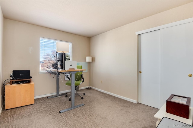 office area featuring light carpet