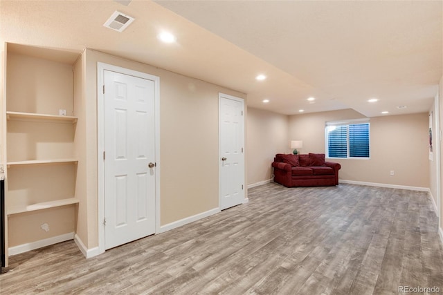 unfurnished room with hardwood / wood-style flooring