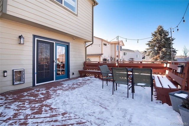 view of snow covered deck