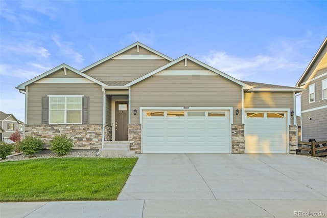 craftsman-style home with a front lawn and a garage