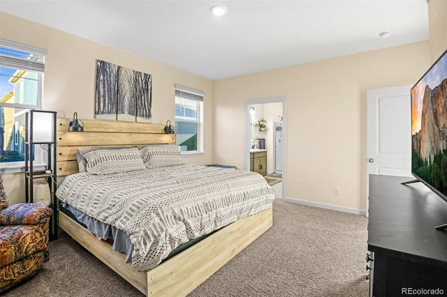 carpeted bedroom featuring connected bathroom