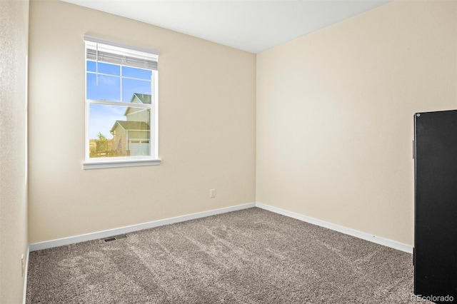 unfurnished room with carpet flooring