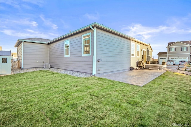 back of property with a yard, a patio area, and cooling unit