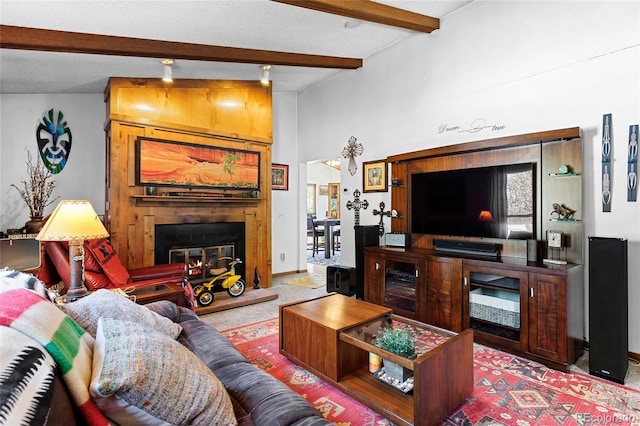 214 Poppy St, Golden, CO 80401 - living area with a fireplace, beamed ceiling, and carpet