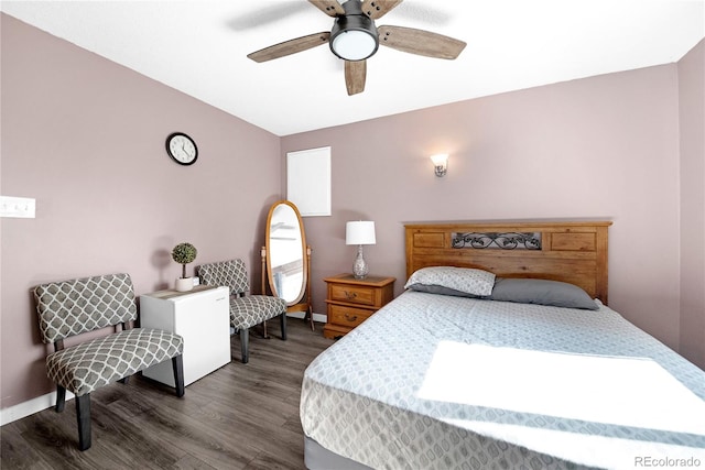 bedroom with dark hardwood / wood-style floors and ceiling fan