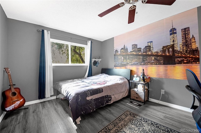 bedroom featuring a textured ceiling, hardwood / wood-style flooring, and ceiling fan