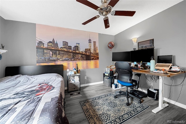 bedroom featuring hardwood / wood-style floors, vaulted ceiling, and ceiling fan