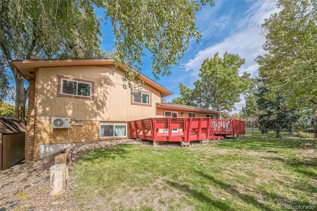 back of house featuring a wooden deck, a yard, and ac unit