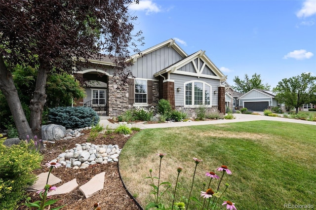 craftsman-style home featuring a garage and a front yard