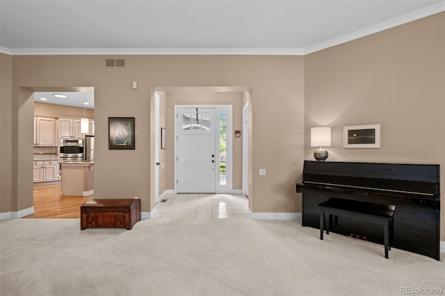 interior space with crown molding and light colored carpet