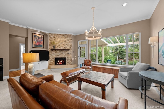 living room featuring a notable chandelier, a fireplace, light colored carpet, and crown molding