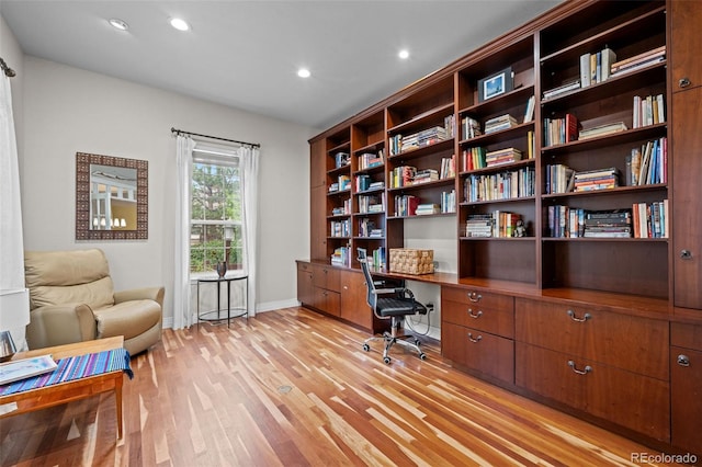 office space with light wood-type flooring