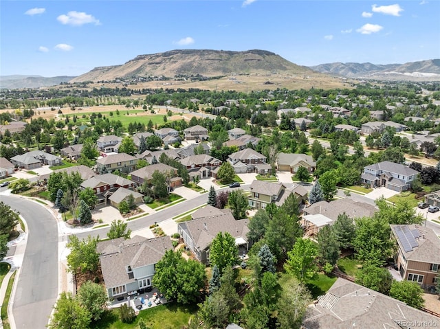 birds eye view of property with a mountain view