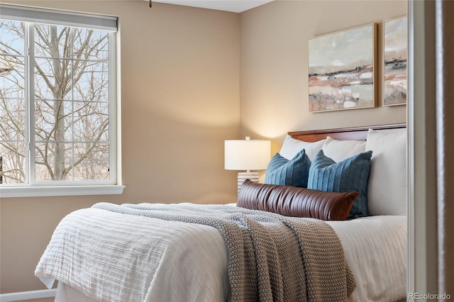 bedroom featuring multiple windows