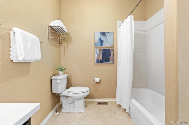 full bathroom with toilet, vanity, tile patterned floors, and shower / bath combo with shower curtain