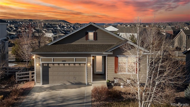 view of front of property with a garage