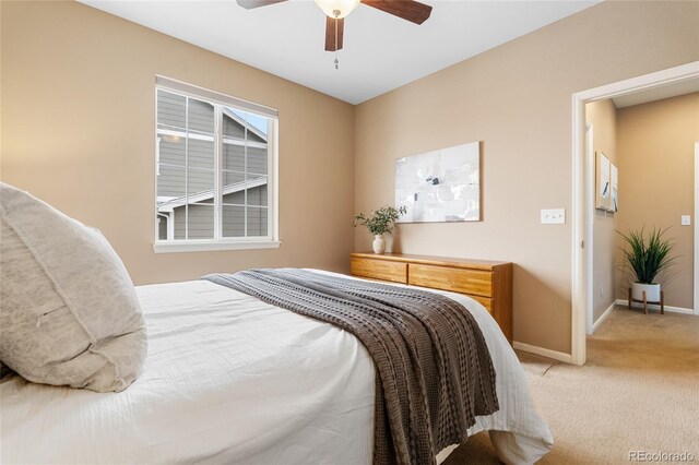 carpeted bedroom featuring ceiling fan