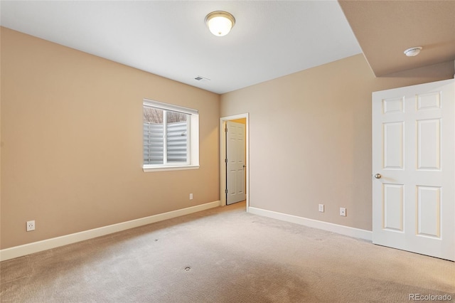 unfurnished bedroom with light colored carpet