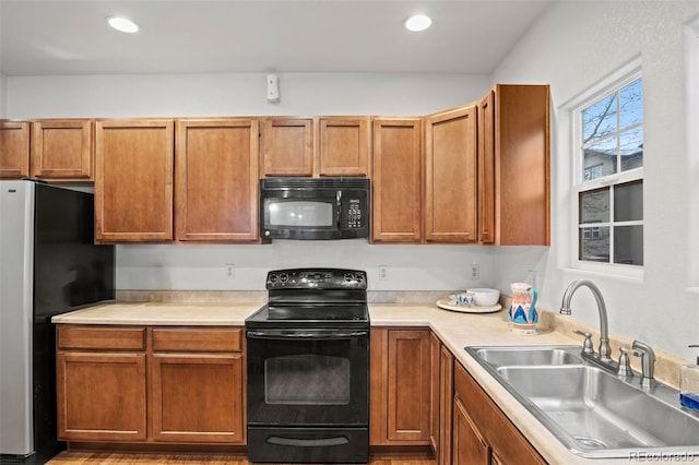 kitchen featuring sink and black appliances