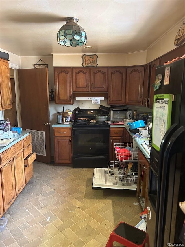 kitchen featuring black appliances and light tile floors