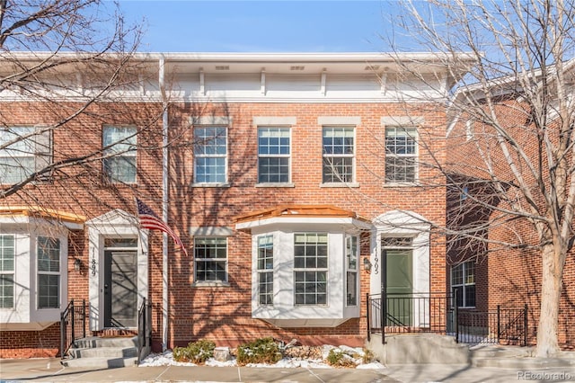 view of front of home with brick siding