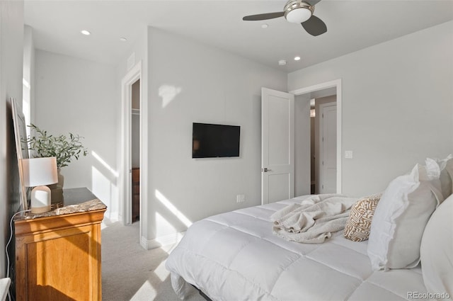 bedroom featuring recessed lighting, light carpet, and a ceiling fan