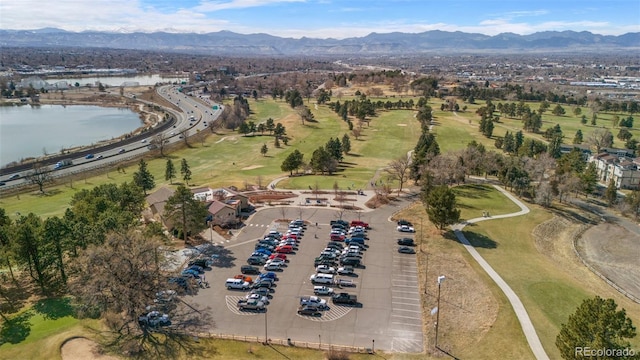 drone / aerial view featuring a water and mountain view