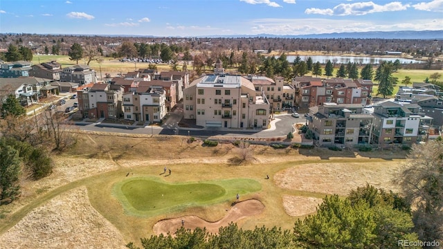 birds eye view of property with a residential view, golf course view, and a water view