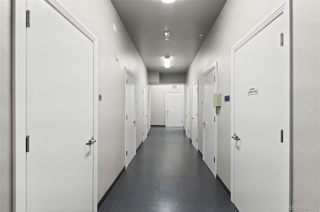 corridor with finished concrete flooring