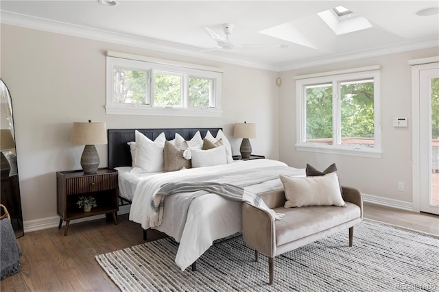 bedroom featuring crown molding, ceiling fan, dark wood-type flooring, and access to outside