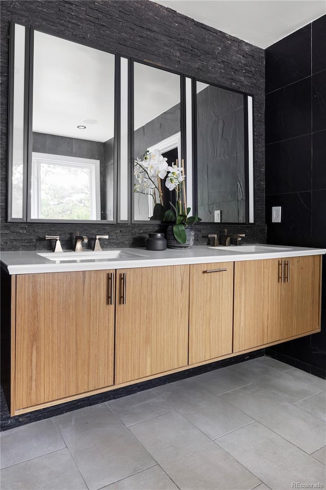 bathroom with tile patterned floors and vanity