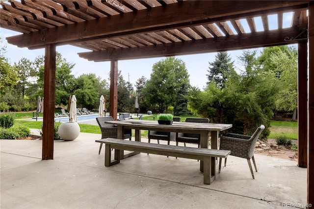 view of patio with a swimming pool and a pergola