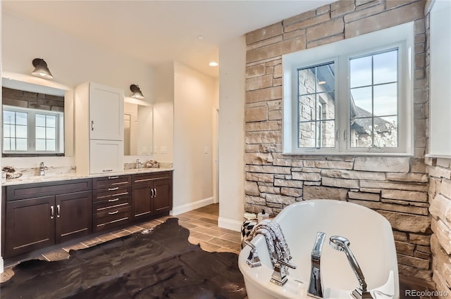 15280 Bannock St, Broomfield, CO 80023 - full bathroom with a freestanding bath, double vanity, and plenty of natural light