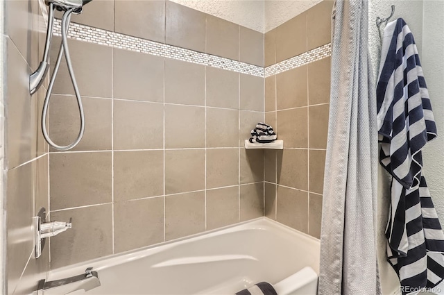 15280 Bannock St, Broomfield, CO 80023 - bathroom featuring shower / bath combo with shower curtain and a textured wall