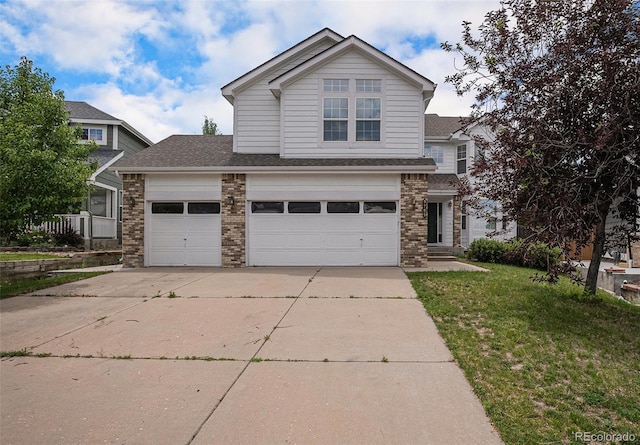 5755 S Zante Cir, Aurora, CO 80015 - traditional home featuring driveway, brick siding, a front yard, a shingled roof, and an attached garage