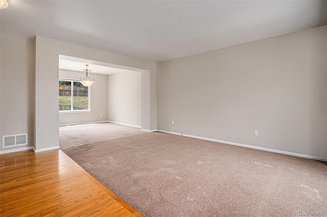 5755 S Zante Cir, Aurora, CO 80015 - carpeted empty room with baseboards and wood finished floors