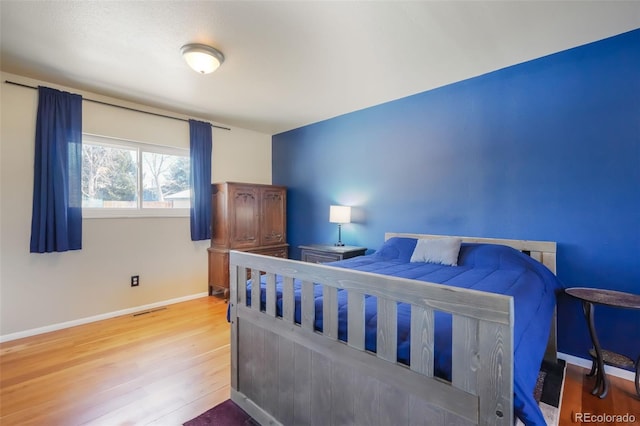 bedroom featuring wood-type flooring