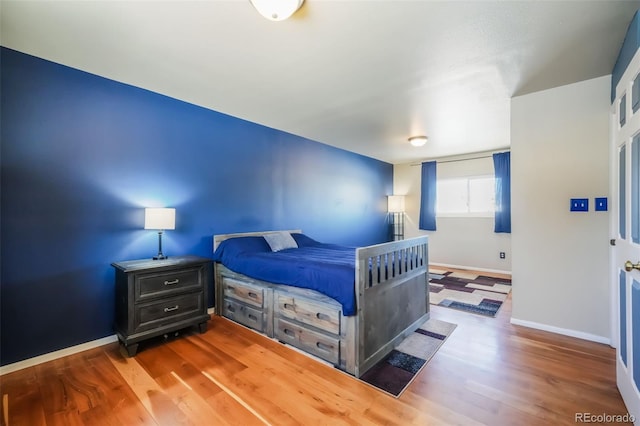 bedroom featuring hardwood / wood-style flooring