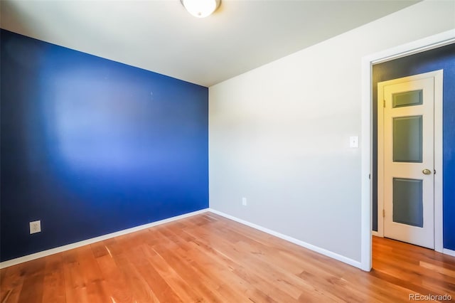 spare room with light hardwood / wood-style floors