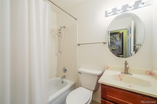 full bathroom with vanity, toilet, and tiled shower / bath