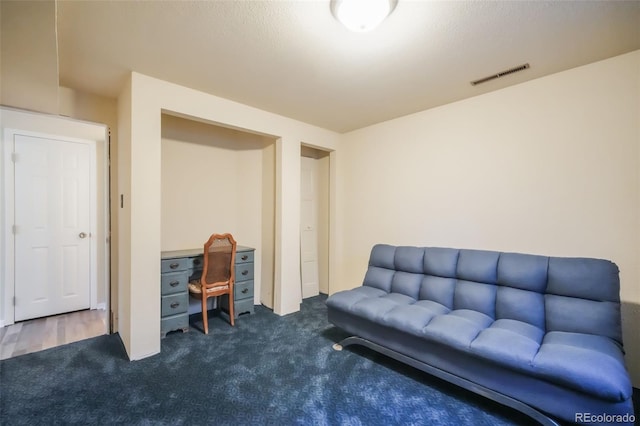 home office featuring dark colored carpet