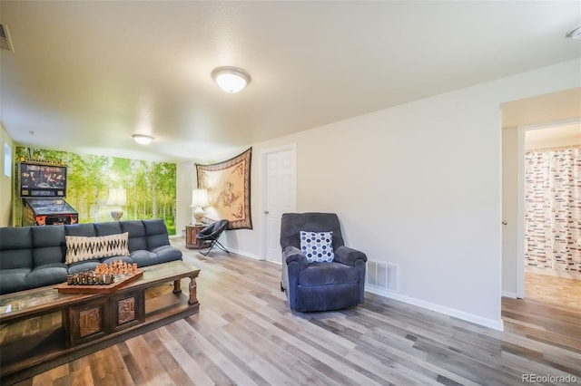 living room with light hardwood / wood-style flooring