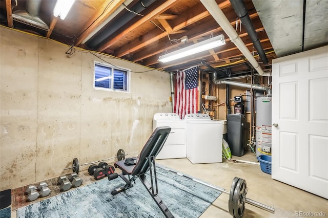 basement with gas water heater and washing machine and clothes dryer