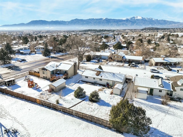 snowy aerial view with a mountain view