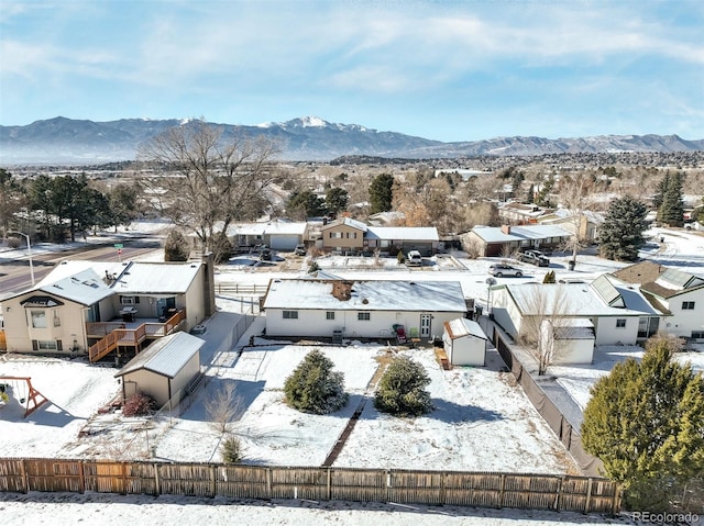 snowy aerial view featuring a mountain view