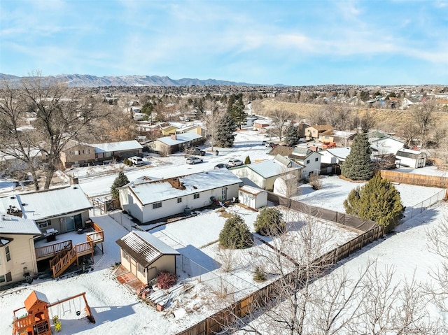 snowy aerial view featuring a mountain view