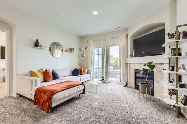 5255 Memphis St Unit 311, Denver, CO 80239 - carpeted living room featuring a fireplace and recessed lighting